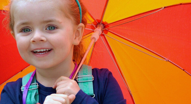kid with umbrella pediatric eye care. Edmonton, AB 640×350